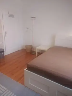 Ein Bett oder Betten in einem Zimmer der Unterkunft Zimmer nähe Festspielhaus/HBF
