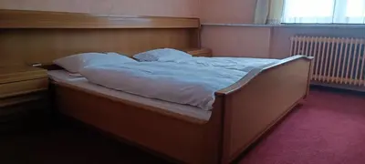 Ein Bett oder Betten in einem Zimmer der Unterkunft Landhotel Jägerhof Ferienwohnung