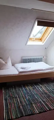 Ein Bett oder Betten in einem Zimmer der Unterkunft Landhotel Jägerhof Ferienwohnung