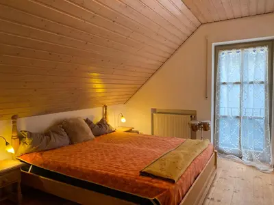 Ein Bett oder Betten in einem Zimmer der Unterkunft Ferienhaus Brühler