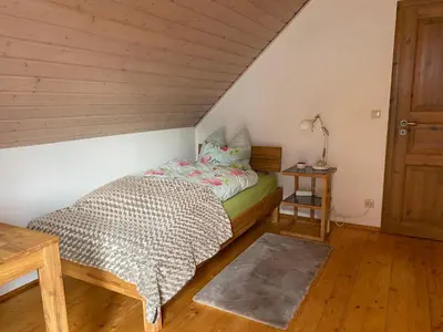 Ein Bett oder Betten in einem Zimmer der Unterkunft Ferienhaus Brühler