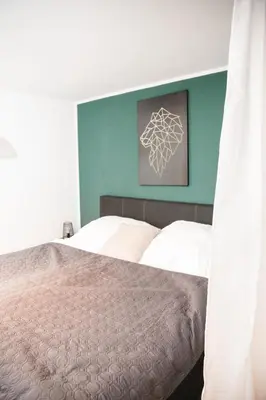 Ein Bett oder Betten in einem Zimmer der Unterkunft Apartment mit Burgblick