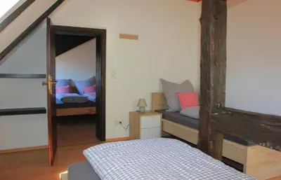 Ein Bett oder Betten in einem Zimmer der Unterkunft Goldener Anker Pottenstein Urlaub für die ganze Familie
