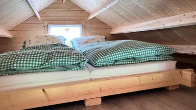 Ein Bett oder Betten in einem Zimmer der Unterkunft Häuslein Waldesruh