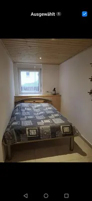 Ein Bett oder Betten in einem Zimmer der Unterkunft Ruhig gelegenes Ferienhaus